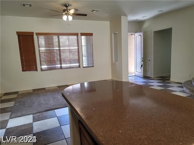 kitchen featuring ceiling fan