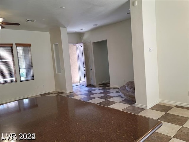 unfurnished room featuring ceiling fan