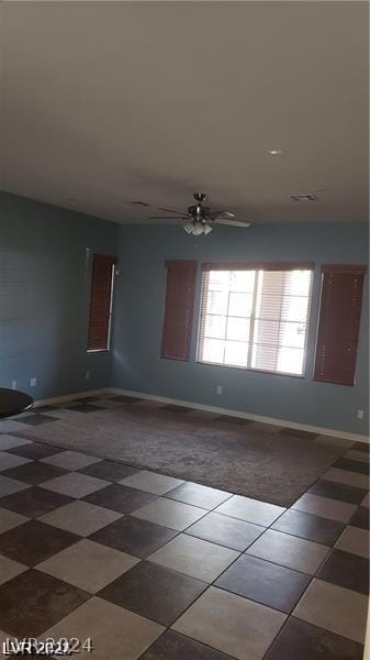 empty room featuring ceiling fan