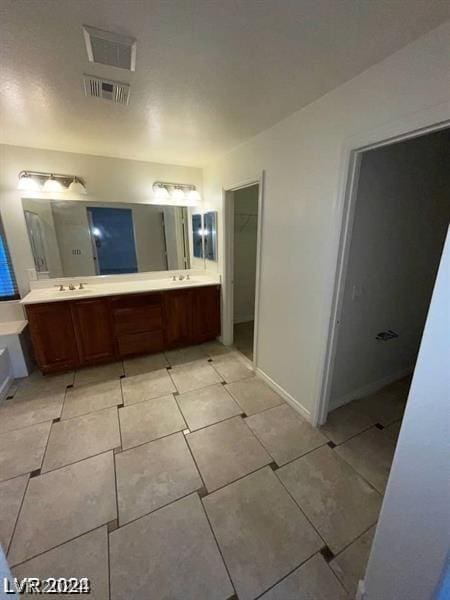 bathroom featuring tile patterned floors and vanity