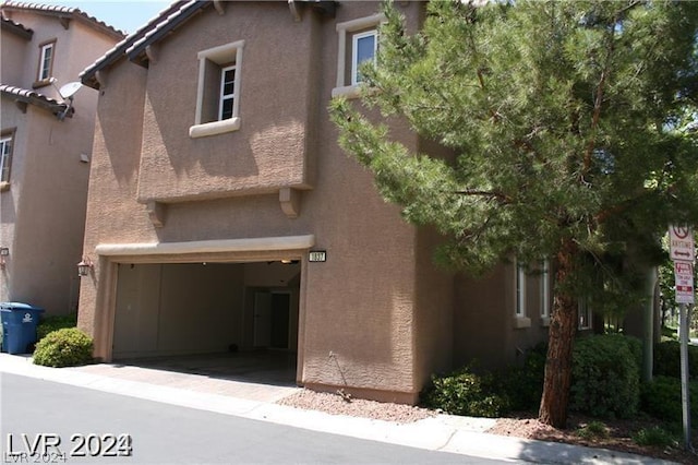 exterior space with a garage