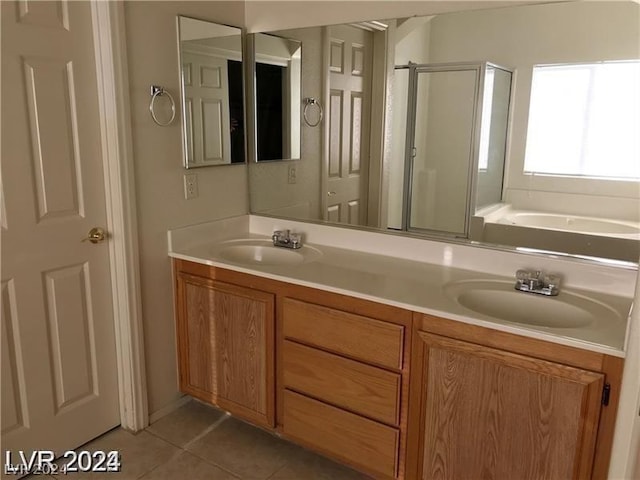 bathroom featuring vanity, tile patterned flooring, and independent shower and bath