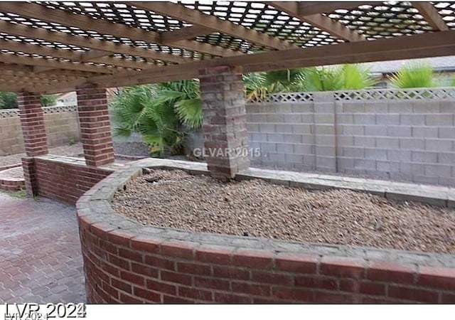 view of patio featuring a pergola