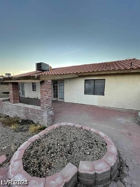 back of house featuring a patio area and central AC