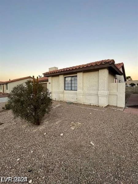 view of property exterior at dusk