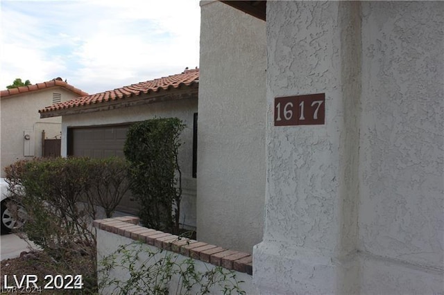 view of side of home featuring a garage