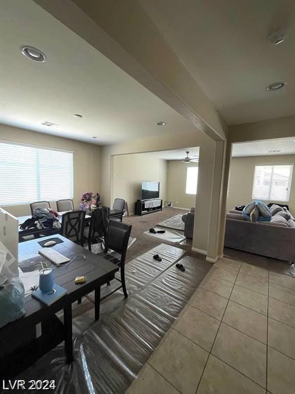 dining space with plenty of natural light and light tile patterned flooring