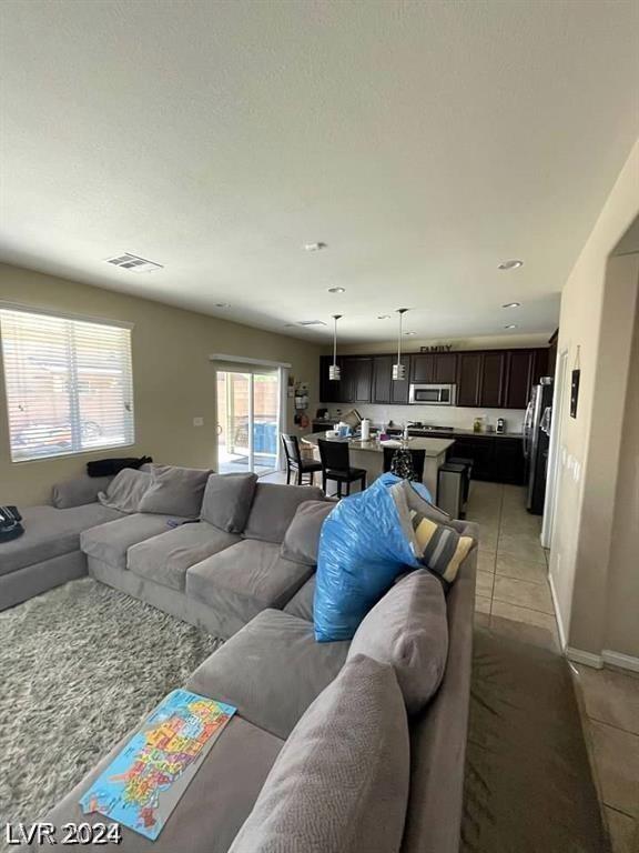 living room featuring light tile patterned flooring