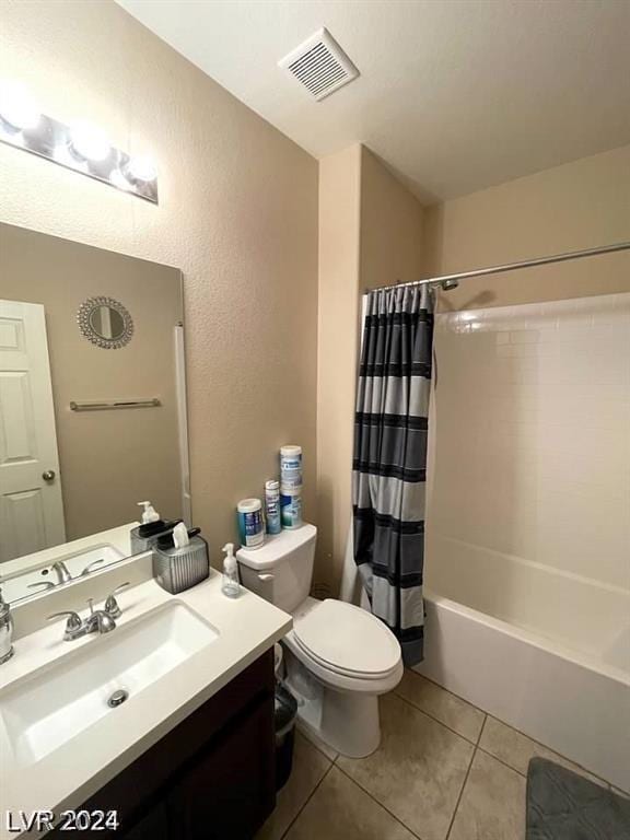 full bathroom featuring toilet, tile patterned flooring, shower / tub combo, and vanity