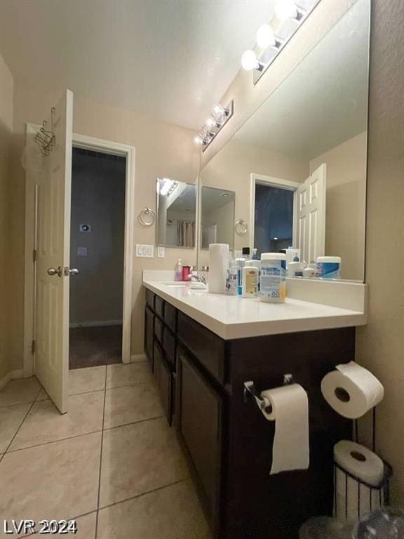 bathroom featuring tile patterned floors and vanity