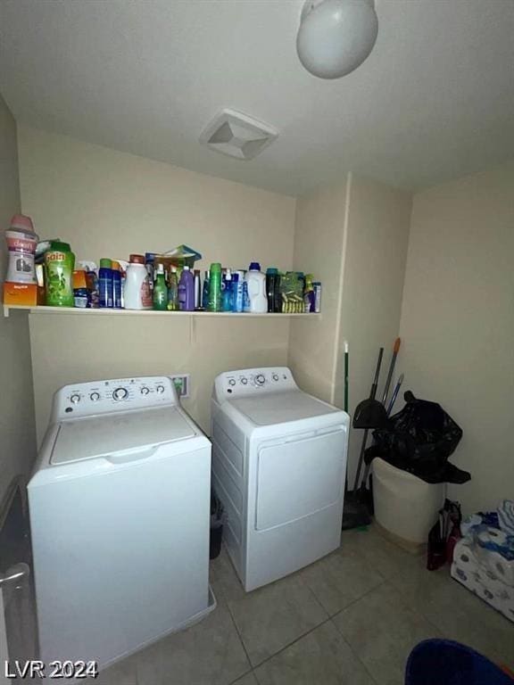 laundry area featuring tile patterned floors and independent washer and dryer