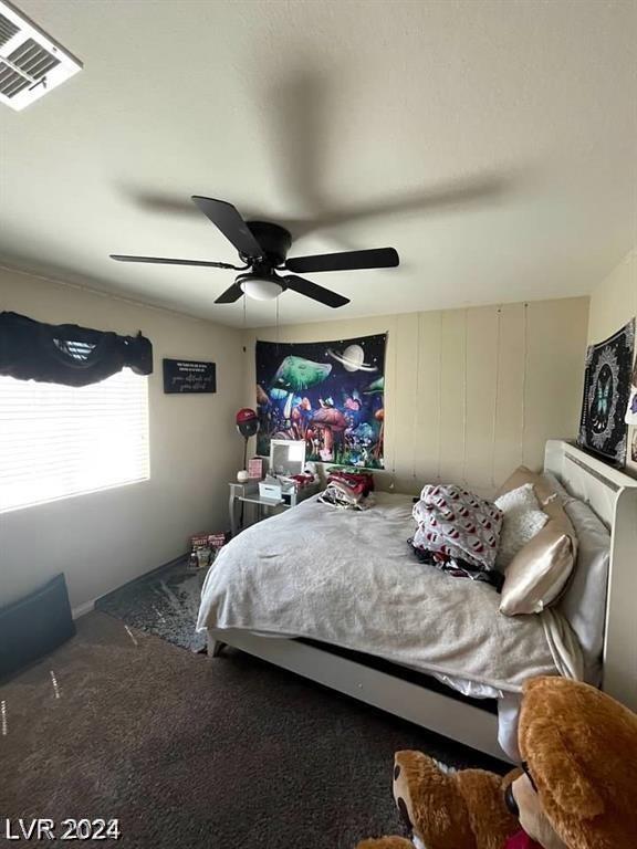 bedroom featuring ceiling fan and carpet floors