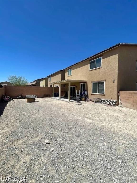 back of house featuring a patio