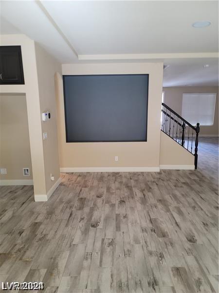 unfurnished room with hardwood / wood-style floors