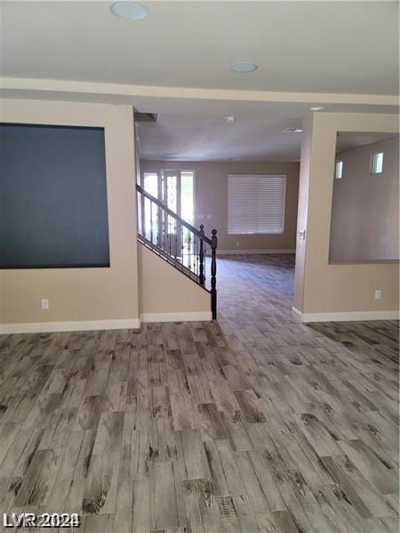 empty room with hardwood / wood-style flooring