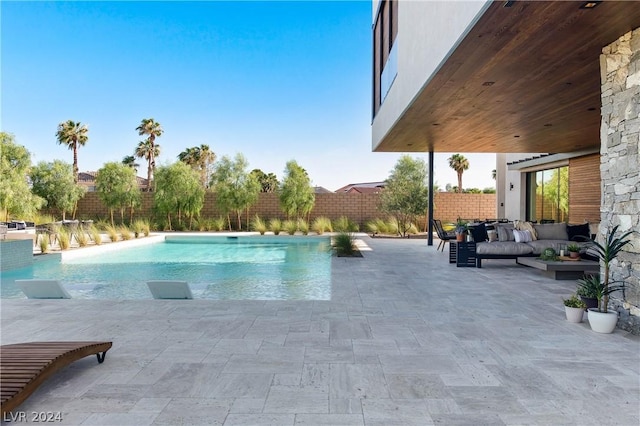 view of pool featuring outdoor lounge area and a patio area