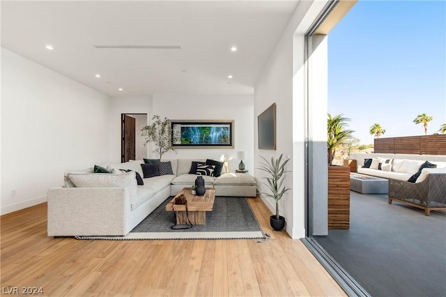 living room with light hardwood / wood-style flooring