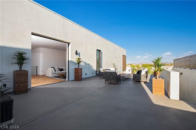 view of patio / terrace featuring an outdoor living space and a wooden deck