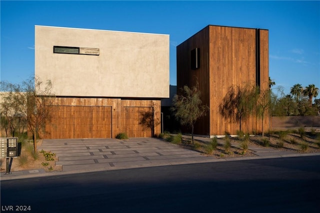 view of side of property with a garage