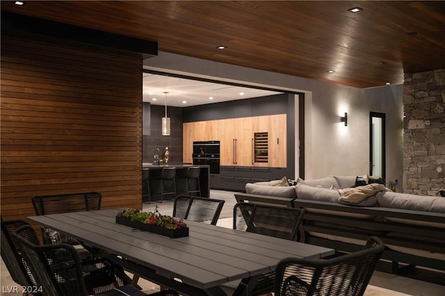 dining area featuring wood ceiling