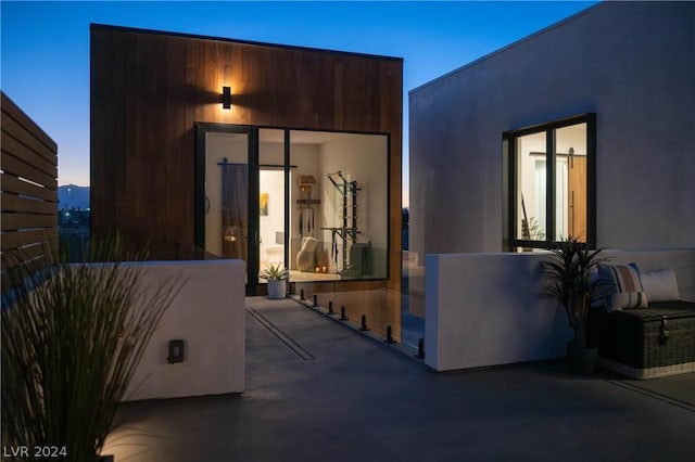 view of patio terrace at dusk