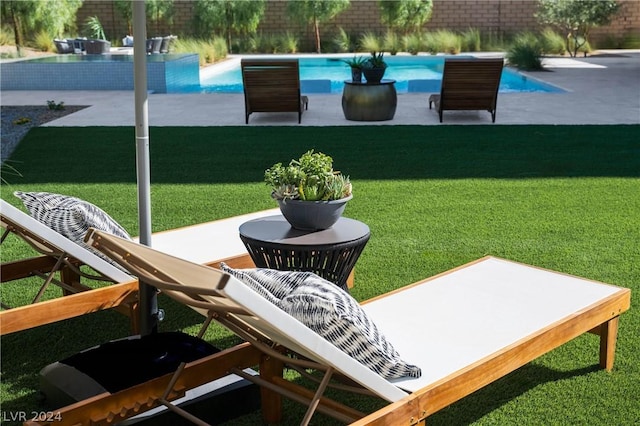 view of yard featuring a patio and a fenced in pool