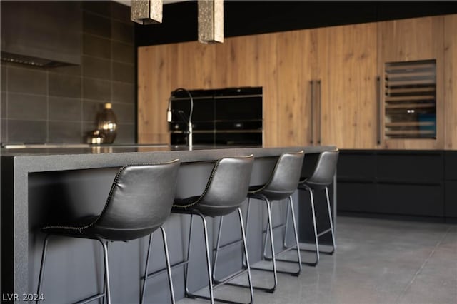 interior space with wood walls and concrete flooring