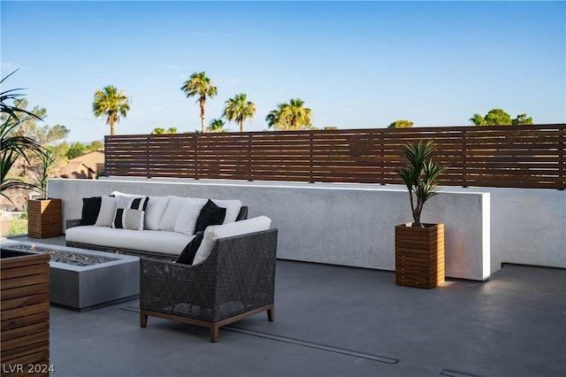 view of patio / terrace featuring an outdoor living space with a fire pit