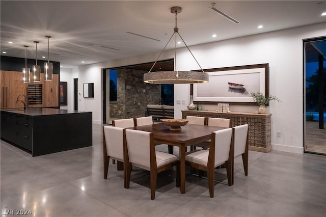 dining space featuring concrete floors