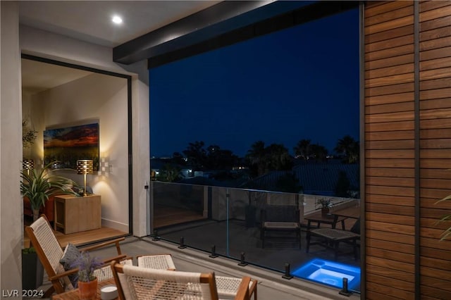 view of balcony at twilight