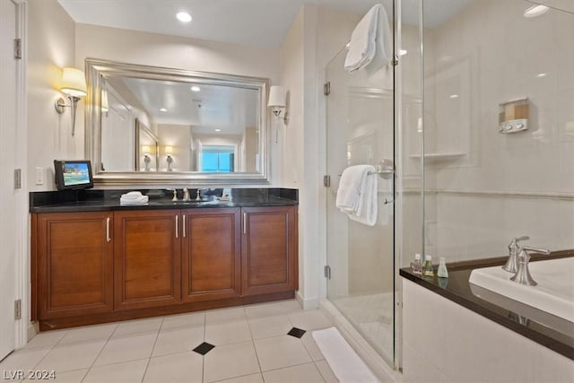 bathroom with vanity, tile patterned floors, and a shower with shower door