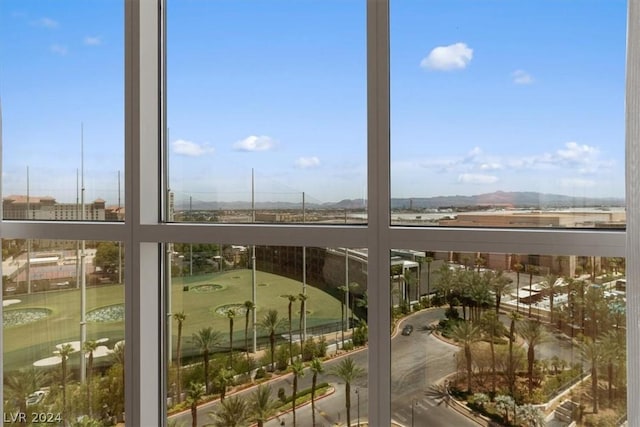 sunroom / solarium featuring a mountain view