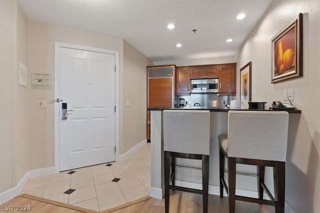 kitchen featuring a breakfast bar and kitchen peninsula