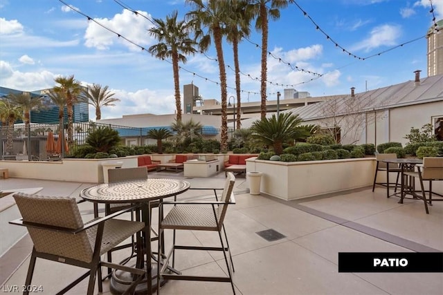 view of patio with fence and outdoor dining area