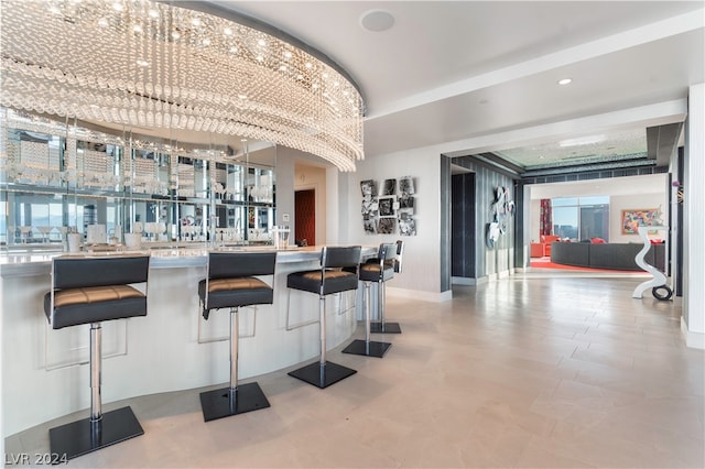 interior space featuring tile patterned flooring and a kitchen breakfast bar