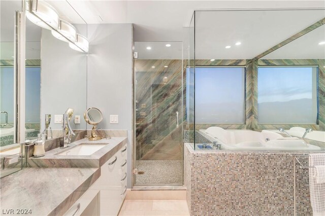 bathroom with vanity, tile patterned flooring, and separate shower and tub