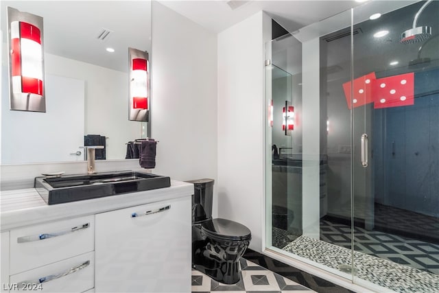 bathroom featuring vanity, tile patterned floors, and an enclosed shower