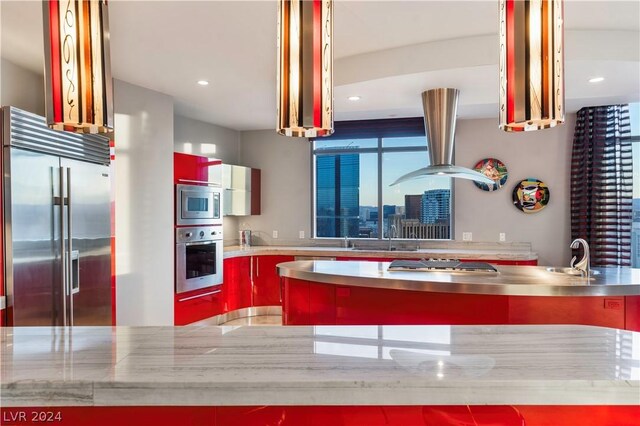 kitchen featuring built in appliances, sink, exhaust hood, and stainless steel counters