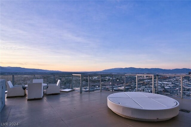 view of patio terrace at dusk