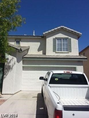 view of front of house featuring washer / clothes dryer and a garage