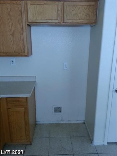 kitchen featuring light brown cabinets and light tile patterned flooring