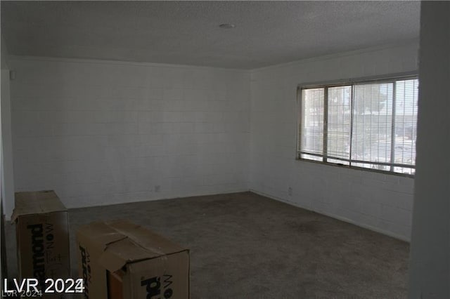 empty room featuring a textured ceiling