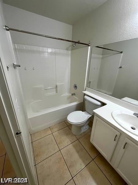 full bathroom with bathtub / shower combination, toilet, vanity, and tile patterned flooring