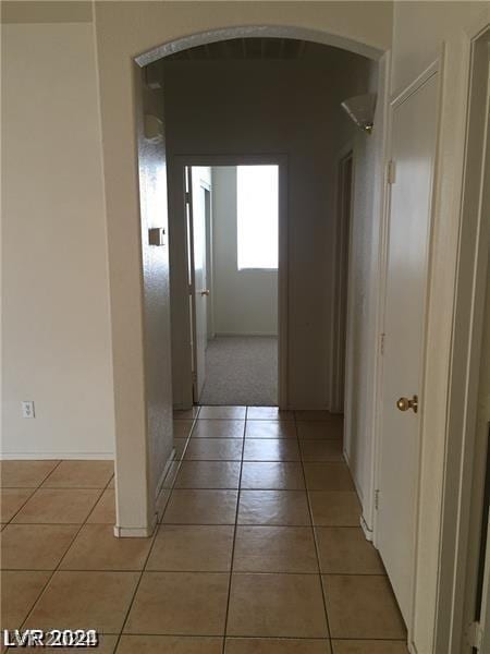 hallway with light tile patterned flooring