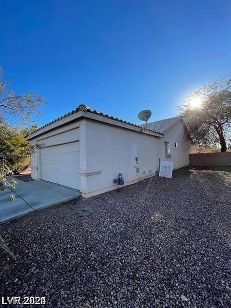 view of property exterior featuring a garage