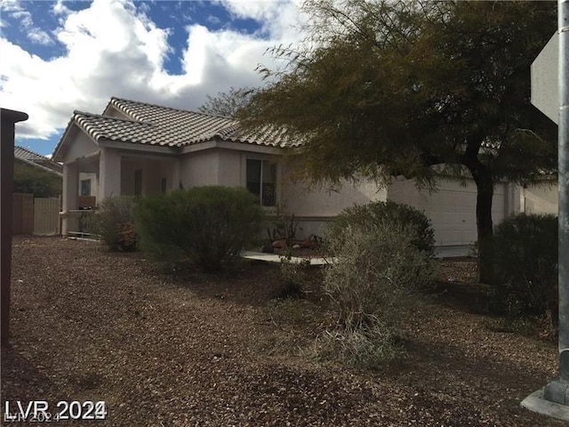 view of side of property featuring a garage