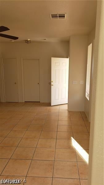 hallway with light tile patterned floors