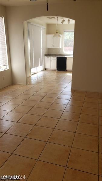 unfurnished living room featuring light tile patterned flooring