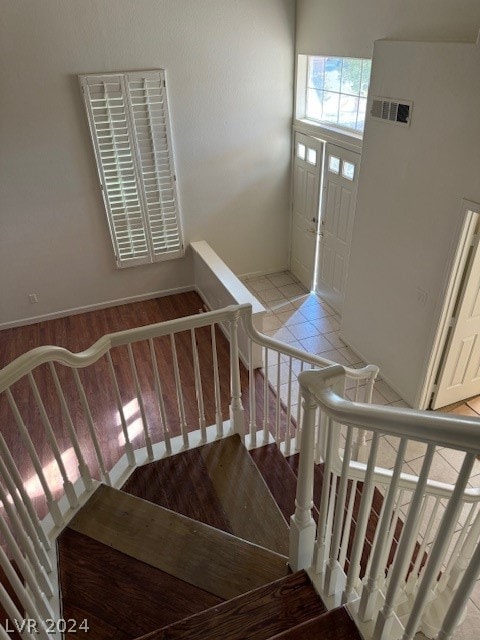 staircase with tile patterned flooring