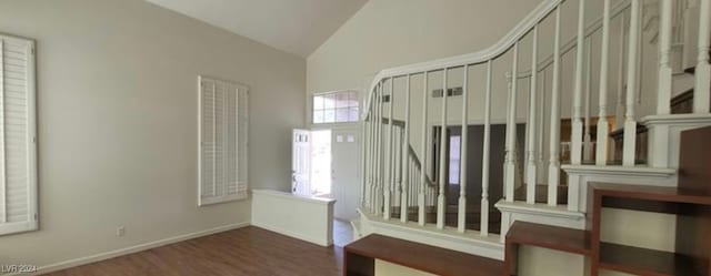 interior space with vaulted ceiling and hardwood / wood-style floors